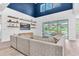 Modern living room with high ceilings, decorative shelving and view to the outdoor pool at 2641 Whittler Br, Odessa, FL 33556