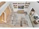 Bright living room showcasing modern decor, a large sectional, and decorative shelving at 2641 Whittler Br, Odessa, FL 33556