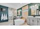 Luxurious main bathroom with freestanding tub, dual vanity sinks, and trendy finishes at 2641 Whittler Br, Odessa, FL 33556
