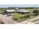 Aerial view of the community marketplace with buildings and ample parking at 2641 Whittler Br, Odessa, FL 33556