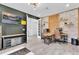 A stylish home office featuring exposed brick, modern decor, and workspace for two at 2641 Whittler Br, Odessa, FL 33556
