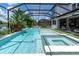 Sparkling pool with a spa, water feature, and a screened-in lanai at 2641 Whittler Br, Odessa, FL 33556