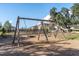 Wooden swingset for enjoyment in the community park at 2641 Whittler Br, Odessa, FL 33556