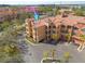 Stunning aerial view of a multi-story building with terracotta roofs and manicured landscaping at 2722 Via Tivoli # 430A, Clearwater, FL 33764