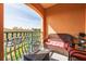 Relaxing balcony features comfortable wicker seating, views of the outdoors, and wrought iron railings at 2722 Via Tivoli # 430A, Clearwater, FL 33764