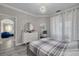 Well-lit bedroom with modern dresser, mirror, and decor with hardwood flooring at 2722 Via Tivoli # 430A, Clearwater, FL 33764
