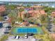 Aerial view of a multi-story building with a red tile roof, surrounded by parking and landscaping at 2722 Via Tivoli # 430A, Clearwater, FL 33764