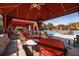 Cabana lounge area with covered seating and plush outdoor furniture overlooking the community pool at 2722 Via Tivoli # 430A, Clearwater, FL 33764