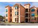 Exterior view of a multi-story condo building featuring private balconies at 2722 Via Tivoli # 430A, Clearwater, FL 33764