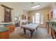 Game room with pool table, seating, and office space at 2722 Via Tivoli # 430A, Clearwater, FL 33764