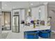 Modern kitchen with white cabinets, stainless steel appliances, and breakfast bar at 2722 Via Tivoli # 430A, Clearwater, FL 33764