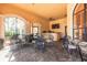 Outdoor patio with ample seating, ceiling fan, and views of the community pool at 2722 Via Tivoli # 430A, Clearwater, FL 33764