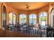 Covered outdoor patio featuring ceiling fans, comfortable seating, and views of the pool at 2722 Via Tivoli # 430A, Clearwater, FL 33764