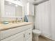 Cozy bathroom featuring a shower and tub combo, single vanity and neutral tones at 2969 Bonaventure Cir # 104, Palm Harbor, FL 34684
