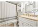 Bathroom featuring a shower and tub combo, single vanity and neutral tones at 2969 Bonaventure Cir # 104, Palm Harbor, FL 34684