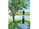 Convenient pet waste station by the community pond, encouraging a clean environment for all at 2969 Bonaventure Cir # 104, Palm Harbor, FL 34684