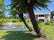 Charming two-story villa with lush landscaping and a serene pond view with fountain at 2969 Bonaventure Cir # 104, Palm Harbor, FL 34684