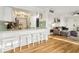 Eat-in kitchen featuring a breakfast bar with hardwood floors and stylish decor at 2969 Bonaventure Cir # 104, Palm Harbor, FL 34684