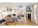 Bright living room with stylish decor, hardwood floors and modern ceiling fan at 2969 Bonaventure Cir # 104, Palm Harbor, FL 34684