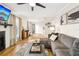 Bright living room featuring hardwood floors, large sectional, and modern decor at 2969 Bonaventure Cir # 104, Palm Harbor, FL 34684