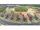 Aerial view of homes in a neatly planned neighborhood with manicured lawns and access to lakes at 3166 Francoa Dr, Odessa, FL 33556