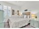 Bedroom with stylish bed, shutters, and matching dressers for a serene retreat at 3166 Francoa Dr, Odessa, FL 33556