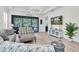Inviting living room featuring a stylish decor and a view of the outdoor pool area at 3166 Francoa Dr, Odessa, FL 33556