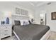 Bright main bedroom features a king-size bed, light-colored walls, and two nightstands with lamps at 3166 Francoa Dr, Odessa, FL 33556