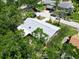 Aerial shot showcasing a home with a gray roof in a lush neighborhood at 3224 Hilary Cir, Palm Harbor, FL 34684