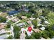 Aerial view of community with pool, tennis courts, clubhouse, and mature landscaping at 3224 Hilary Cir, Palm Harbor, FL 34684
