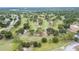 Beautiful aerial view of golf course, trees and some houses in the neighborhood at 3224 Hilary Cir, Palm Harbor, FL 34684