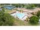 Aerial view of community pool and clubhouse; perfect for recreation and relaxation at 3224 Hilary Cir, Palm Harbor, FL 34684