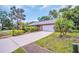 Charming single story home featuring a two car garage and landscaped yard at 3224 Hilary Cir, Palm Harbor, FL 34684