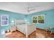 Bedroom featuring two windows, tile floors, a ceiling fan and a white bedframe at 3224 Hilary Cir, Palm Harbor, FL 34684
