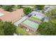 Overhead view of shuffleboard courts, parking lot, and rec center in community at 3224 Hilary Cir, Palm Harbor, FL 34684
