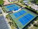 Aerial view of the community's tennis courts showcasing well-maintained recreational facilities at 3224 Hilary Cir, Palm Harbor, FL 34684