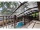 Overhead view from an outdoor balcony featuring the pool and fenced backyard at 3406 Hollyhock Way, Tampa, FL 33618