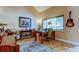 Bright dining room with neutral walls, guitars, and ample natural light at 3406 Hollyhock Way, Tampa, FL 33618