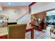 Bright, open dining room featuring a staircase, piano, and access to the kitchen at 3406 Hollyhock Way, Tampa, FL 33618