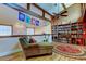 Inviting living room featuring a comfortable chaise lounge, and custom shelving at 3406 Hollyhock Way, Tampa, FL 33618