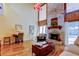 Bright living room with high ceilings, stone fireplace, and access to the pool area at 3406 Hollyhock Way, Tampa, FL 33618