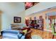 Spacious living room with cozy seating, entertainment center, and bright lighting at 3406 Hollyhock Way, Tampa, FL 33618