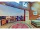 Cozy living room showcasing wood flooring, high ceilings, and book-lined walls at 3406 Hollyhock Way, Tampa, FL 33618