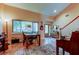 Open living space with windows, tile floor, and entry door at 3406 Hollyhock Way, Tampa, FL 33618