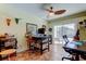 Bright office with natural light from sliding doors, tiled floors, and ceiling fan at 3406 Hollyhock Way, Tampa, FL 33618