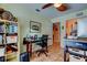 Bright office featuring tiled floors, ceiling fan, and an adjacent hallway at 3406 Hollyhock Way, Tampa, FL 33618