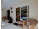 Enclosed patio showcases wicker furniture, a water feature, and sliding glass doors at 3406 Hollyhock Way, Tampa, FL 33618
