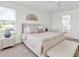 Bright bedroom with a connecting bathroom that features a coordinated décor and bench at 3757 Villamore Ln, Odessa, FL 33556