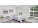 Cozy bedroom with a single bed, desk, and vibrant artwork at 3757 Villamore Ln, Odessa, FL 33556
