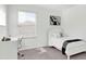 Serene bedroom with a minimalist design, natural light, and a dedicated study area at 3757 Villamore Ln, Odessa, FL 33556